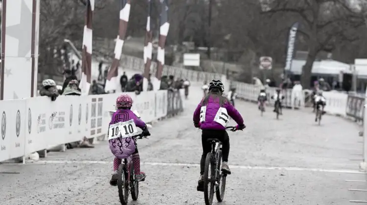 Gretchen Wayman and Mckenna Wilkins, both in Purple and from Texas, started the Junior 9-10 race together and tackled the tough course and conditions together. © Cyclocross Magazine
