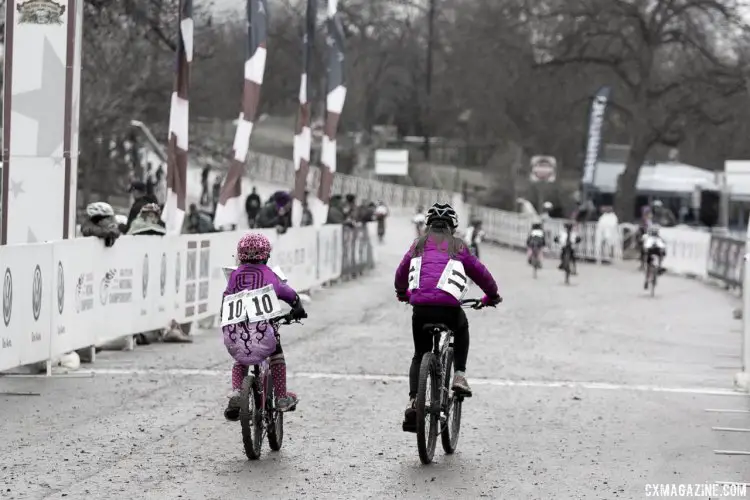 Gretchen Wayman and Mckenna Wilkins, both in Purple and from Texas, started the Junior 9-10 race together and tackled the tough course and conditions together. © Cyclocross Magazine