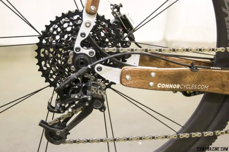 Chris Connor did some playing with SRAM components for this customer's bike, and manged to pair an X0 rear derailleur with an XD 10-42 11-speed cassette and Force 11-speed road shifter. NAHBS 2015. © Cyclocross Magazine