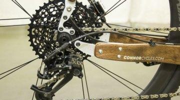 Chris Connor from Connor Wood Bicycles did some playing with SRAM components for this customer's bike, and manged to pair an X0 rear derailleur with an XD 10-42 11-speed cassette and Force 11-speed road shifter. NAHBS 2015. © Cyclocross Magazine