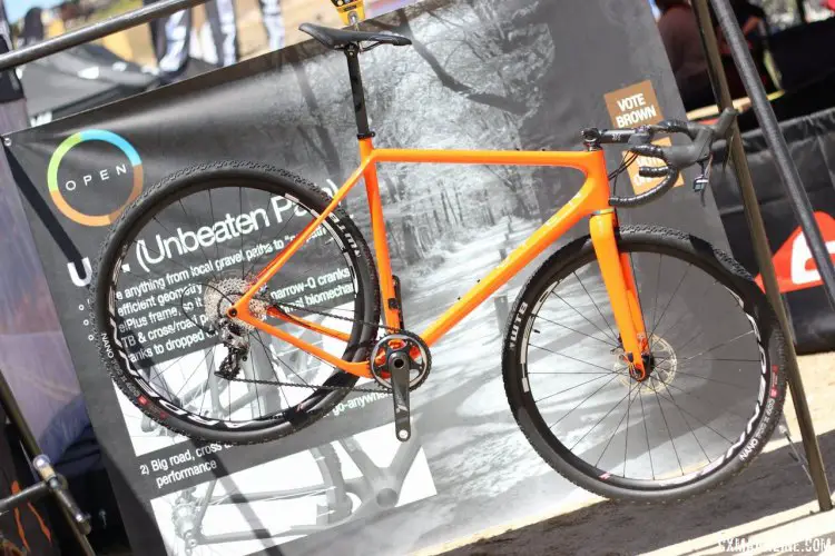 Open Cycle showing off their new U. P. cyclocross bike, which has a massive tire clearance: bigger than 40c with 700c wheels, or 2.4'' with 650b wheels. © Cyclocross Magazine