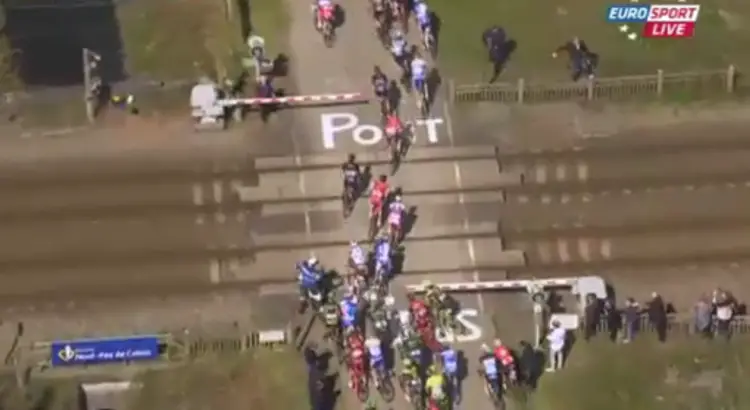 Train crossing at Paris-Roubaix, splitting the peloton