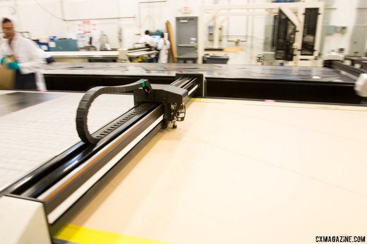 Computer-controlled cutting of the carbon fiber layers before lay-up. Zipp Speed Weaponry Factory Tour. © Cyclocross Magazine