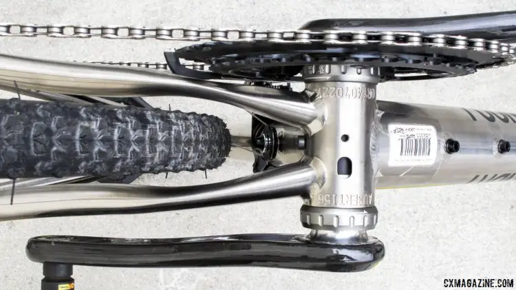 flattened and arched chainstays with a bridgeless design coming off the 68mm threaded bottom bracket offer excellent fat tire clearance. Note the extra bottle bosses on the underside of the downtube, and the BB drain hole. There's a screw just behind the bottom braket for? A fender? It would require a special bracket to clear the bolt on pulley