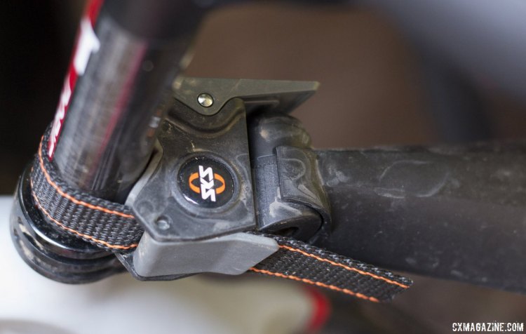The SKS XTRA DRY XL fender is attached with the right quick release lever (top) once the left buckle is set in an appropriate spot (bottom). © Cyclocross Magazine