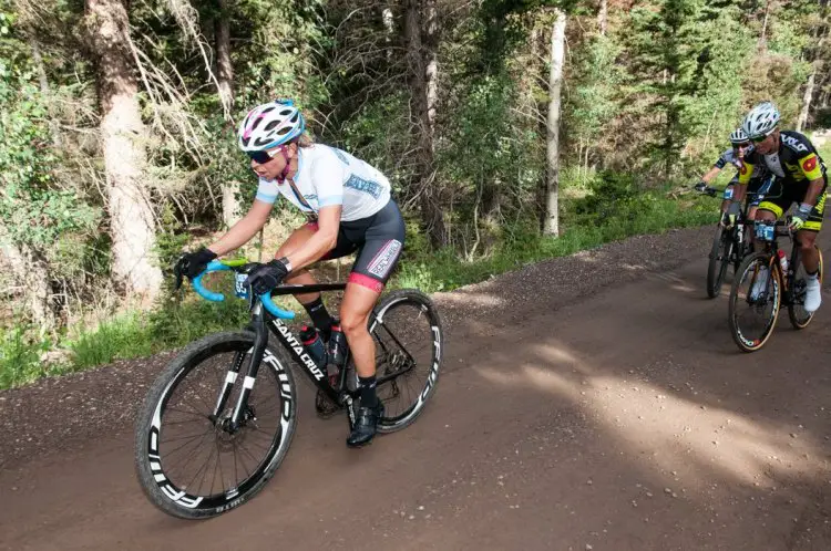 Pro/Open Women winner Robin Farina (realwheelbikes.com) pushing the pace on the first climb to start opening the gap to eventual 3rd place finisher Mindy McCutcheon (obscured). Photo: Christopher See