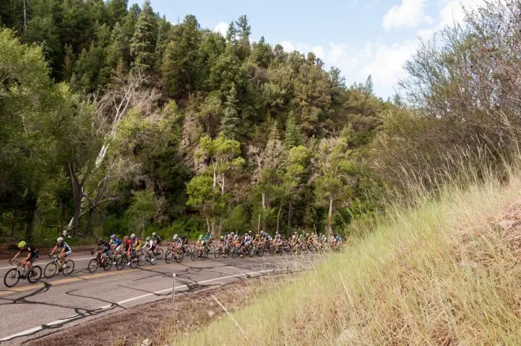 The men race along the pavement on the their way to the first dirt climb of the day. The Crusher in the Tushar runs through remote wilderness areas in the Tushar Mountains and the Fishlake National Forest.