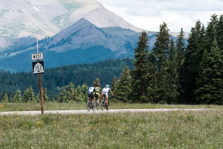 Go west, young man! A group of riders from the men’s race pedals through a meadow at 10,700 feet on the way to the finish at Eagle Point ski resort.