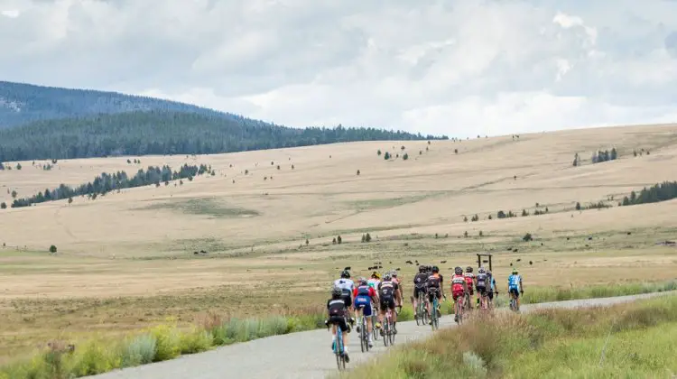 Here the group ramps up the lower reaches of 6,000 ft Mullen Pass under a roiling Montana sky. During the afternoon endurance rides, the group would often cross over the Continental Divide several times. © Tom Robertson