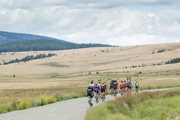 Here the group ramps up the lower reaches of 6,000 ft Mullen Pass under a roiling Montana sky. During the afternoon endurance rides, the group would often cross over the Continental Divide several times. © Tom Robertson
