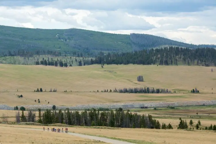 Climbing Mullen Pass, the group begins to amp up the pace with KOM bragging rights at stake. © Tom Robertson.