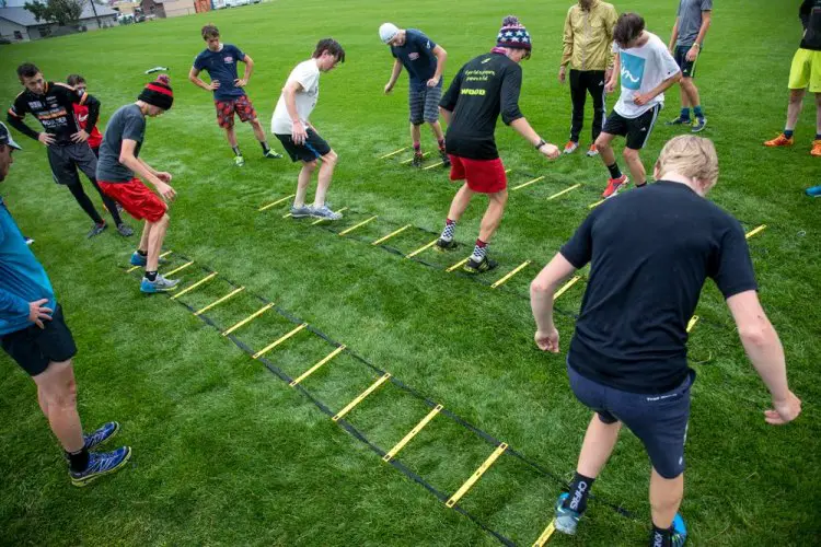 Cyclocross demands careful footwork.  Early morning conditioning incorporates the training of several systems. Here, riders work on footwork via agility ladders. © Tom Robertson