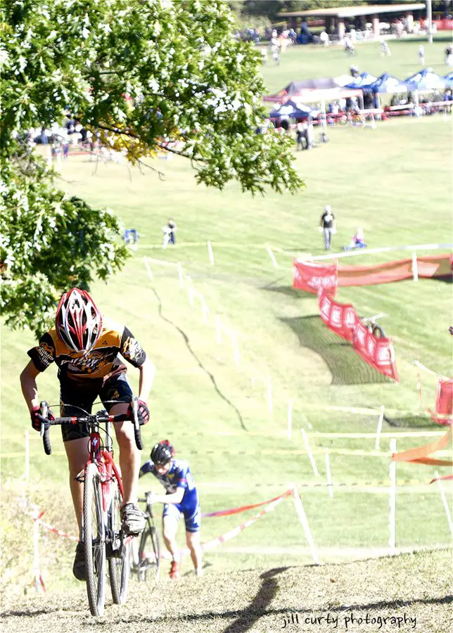 The Juniors 10-14 category climb one of the hills at Dan Ryan Woods. Some choose to run up the steep climb.