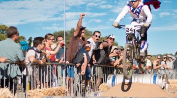 Evil Knielvel gets big air, entertains fans over the beer kegs. 2015 ClifBar Cykel Scramble. © A. Yee / Cyclocross Magazine