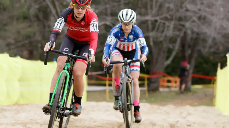 Emma White leads Ellen Noble through the sandpit. Photo by Todd Prekaski