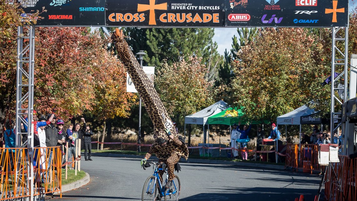 Best costume of the day was a HUGE giraffe that almost didn't make it under the finish banner. © Matthew Lasala