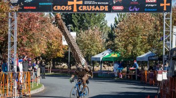 Best costume of the day was a HUGE giraffe that almost didn't make it under the finish banner. © Matthew Lasala