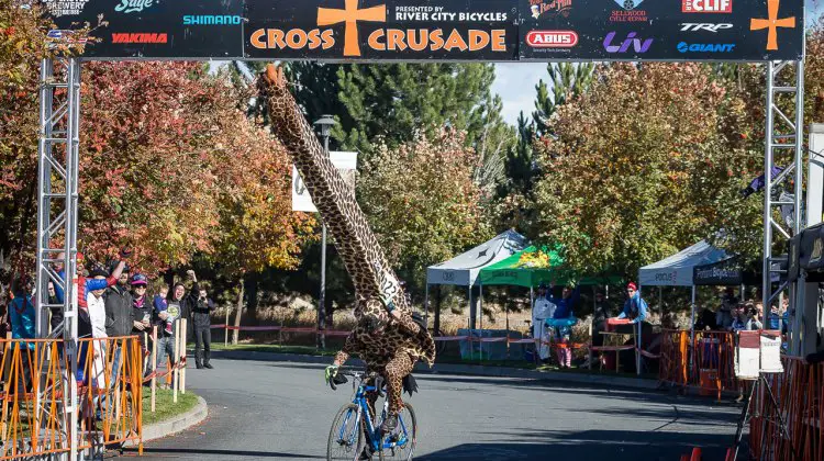 Best costume of the day was a HUGE giraffe that almost didn't make it under the finish banner. © Matthew Lasala