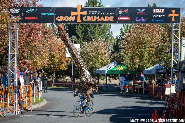 Best costume of the day was a HUGE giraffe that almost didn't make it under the finish banner. © Matthew Lasala