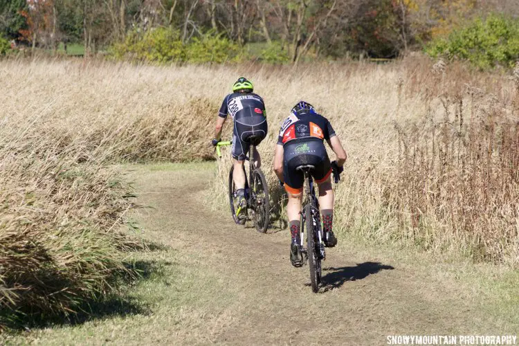 Phil Fluegel (288: Rockton, IL) and PJ Cavato (280, Chicago, IL) battle for the win in the Men's Cat 3 race. © SnowyMountain Photography