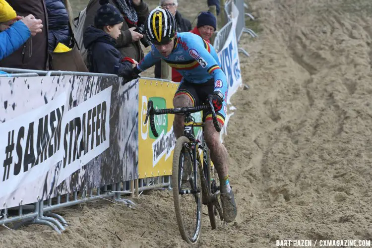 In the treacherous sand, riders look for every bit of advantage they can get, including course barriers, to stay upright. © Bart Hazen
