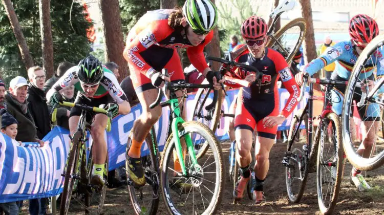 Curtis White rides through traffic on the post run up climb. © Bart Hazen