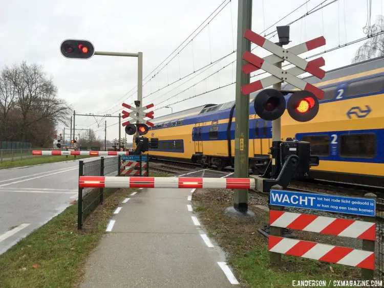 A train crossing in the Netherlands has a lights and a gate for both cars and bikes. 2015 USAC Cyclocross Development Camp. © Elle Anderson