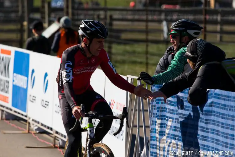 Matthew Timmerman high-fives fans on the finishline. © R. Riott / Cyclocross Magazine