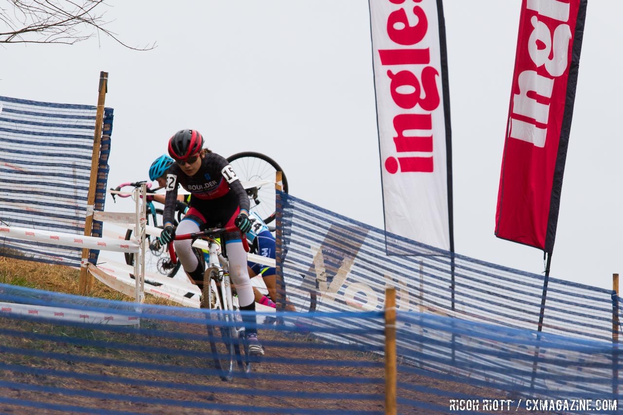 Leading the pack in the first lap, Tea Wright descends from Ingles Heckle Hill