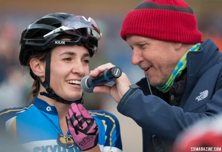 Sofia Gomez Villafane expressing her joy to Richard Fries and the audience after her Collegiate D1 Women win. 2016 Cyclocross National Championships. © Cyclocross Magazine