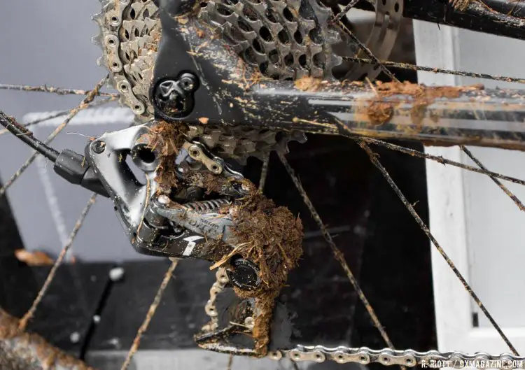 The Sram Force 1 rear derailleur brought half the course along for a ride. The lower pulley wheel is almost completely enveloped in mud and oil. © Cyclocross Magazine