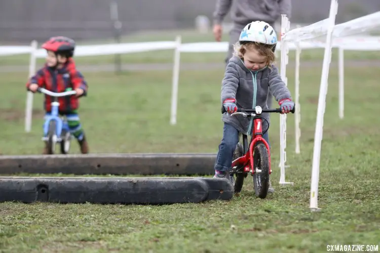 Racing is finding the fastest route between the tape, some say. Kid Cross Race, 2016 Cyclocross National Championships. © Cyclocross Magazine