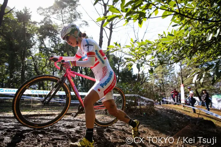 The morning's heavy rain loosened the soil. Kiyoka Sakaguchi runs her bike on way to the win. © CX Tokyo / Kei Tsuji