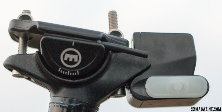 Magura's new Vyron wireless dropper post has a secure two-bolt saddle clamp and an manual on/off switch under the white cover that enables a handful of manual actuations should the battery need a charge. Magura Ride Camp 2016. © Cyclocross Magazine