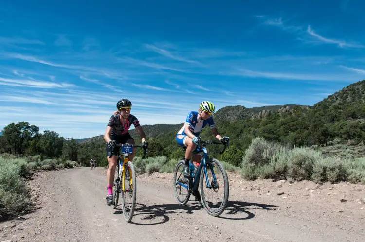 Mindy McCutcheon, left and Robin Farina, right rode side by side for most of the day neither yeilding until the slopes of Col D Crush where McCutheon soloed away for the win. Here the two racers are on Doc Springs Road (also known as the Sarlacc Pit). 2016 Tushar Crusher. Photo courtesy Christopher See