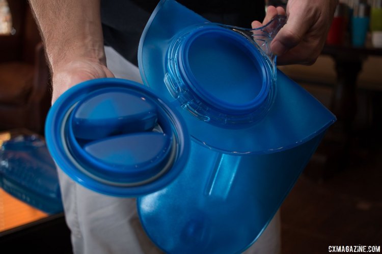CamelBak changed the fill port on its new Antidote bladders. The size is the same, but it doesn't need to be lined up to be threaded closed, closes in a quarter turn, and now folds open and stays open for easy ice and water filling. Press Camp 2016. © Cyclocross Magazine