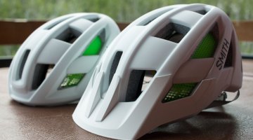Smith's new Route (road, left) and Rover (mtb, right) helmets use different molds but look similar. The Rover has more coverage out back, and comes with a removeable visor. Press Camp 2016. © Cyclocross Magazine