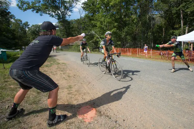 Jan Feuchtner and Davis Kuykendall showing proper dousing technique of Mike Pusey. Photo: Bruce Buckley.