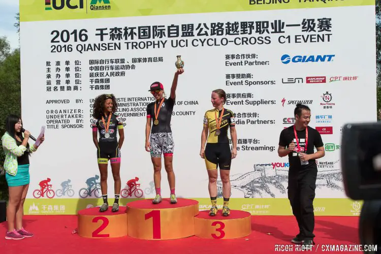 Qiansen Trophy 2016, Yanqing Station Women's podium. 1. Emily Kachorek (Squid Bikes, USA), 2. (Kleur Op Maat - No Drugs, Netherlands), 3. Bianca Van den Hoek (Rijwielpaleis Bilthoven-Mtb Licht Verzat, Netherlands). Qiansen Trophy Race #1, China. © R. Riott / Cyclocross Magazine