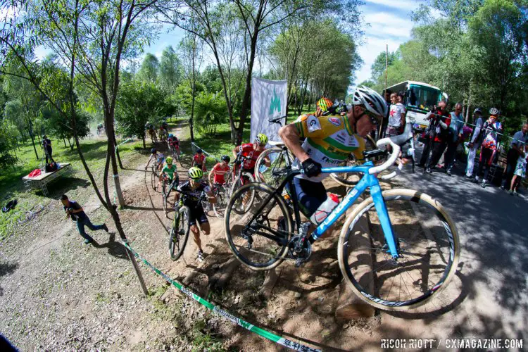 Chris Jongewaard is first up the steaps at the start of the first lap in Yanqing. Qiansen Trophy Race #1, China. © R. Riott / Cyclocross Magazine