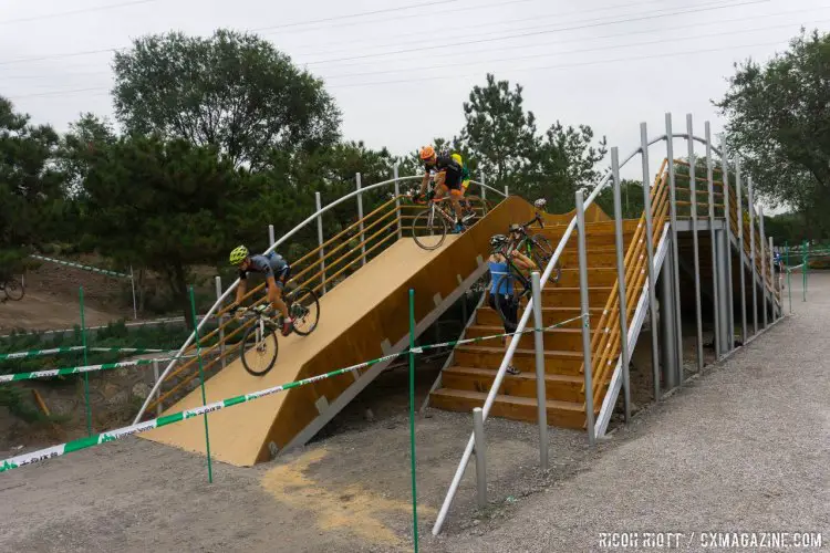 A side-by-side double flyover is an interesting element. Hopefully nothing more than course tape will be needed to separate the two-way traffic. The Qiansen Trophy Cyclocross Race #2 in Fengtai Changxindian. © R. Riott / Cyclocross Magazine