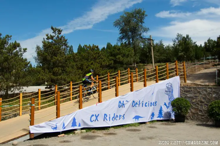 A bit of Jurassic Park here with a hungry Allosaurus, only with cyclocross bikes instead of SUVs. The Qiansen Trophy Cyclocross Race #2 in Fengtai Changxindian. © R. Riott / Cyclocross Magazine