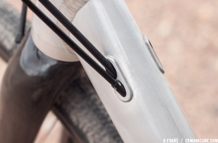 Internal routing through the downtube keeps things clean up front, and a modular cable stop on the drive side offers accommodations for a front derailleur. © Cyclocross Magazine