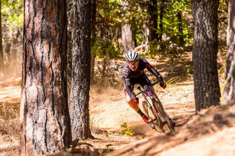 Duncan Riffle rips through the trees on his Santa Cruz Stigmata. © Colin Meagher Photography