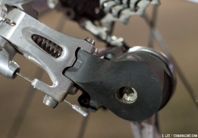 The prototype appears to use a slant parallelagram geometry (unlike SRAM's 1X derailleurs) with a clutch-type mechanism coincident with the top pulley. Mystery prototype rear derailleur seen on Molly Cameron's Focus Mares. © Clifford Lee / Cyclocross Magazine