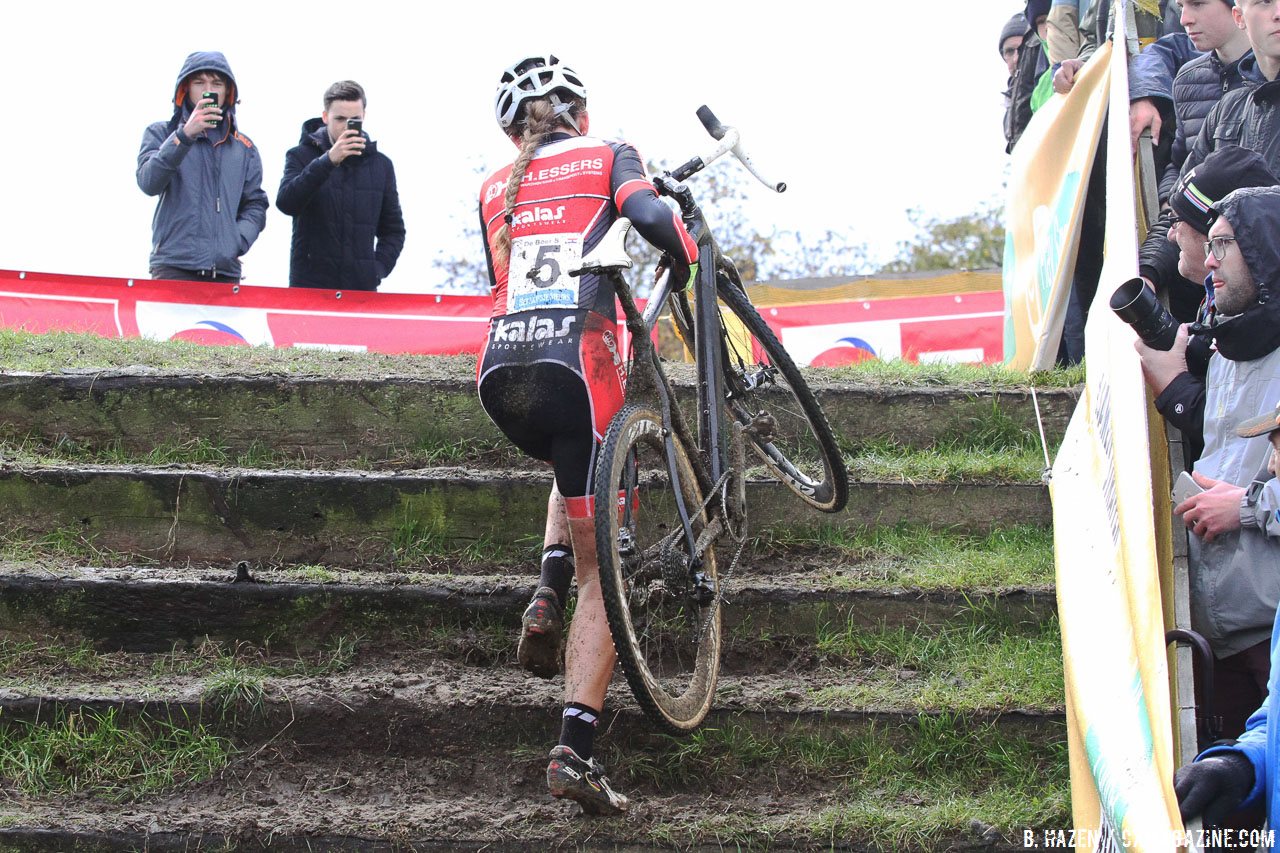 De Boer lifts her California-engineered mystery bike up the stairs to victory. 2016 Superprestige Ruddervoorde cyclocross race, Elite Women. © B. Hazen / Cyclocross Magazine