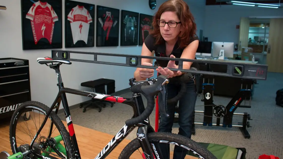 No matter how long you've been racing, a bike fit can be invaluable in addressing physical issues or adapting to a new bike, or aging body. photo: Specialized's Julie Bates helps dial in a bike fit. © Cyclocross Magazine