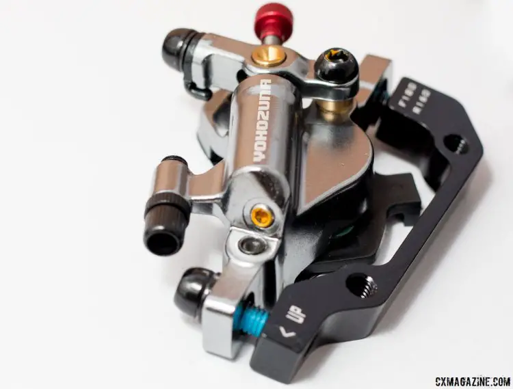 Yokozuna Motoko cable-pull hydraulic disc brake is a closed system - no reservoir or bleeding needed. The caliper comes with an IS mount adaptor. © Cyclocross Magazine