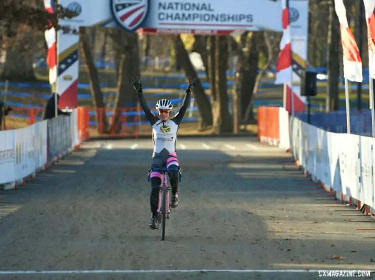 Avanell Schmitz raises her hands in victory at the finish. 2017 Cyclocross National Championships, Masters Women 30-34. © A. Yee / Cyclocross Magazine