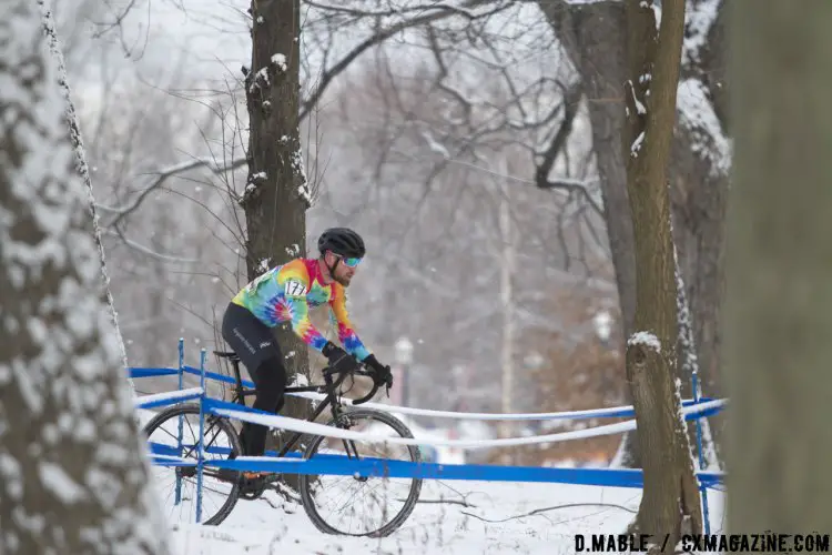 Jacob Huizenga (Chicago Cuttin Crew) stands out against the snowy backdrop with his rainbow tye-die jersey. 2017 Cyclocross National Championships Masters Men 30-34. © D. Mable / Cyclocross Magazine